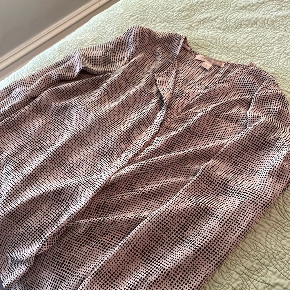 Soft pink and black patterned half button up blouse.  Loose flattering belly